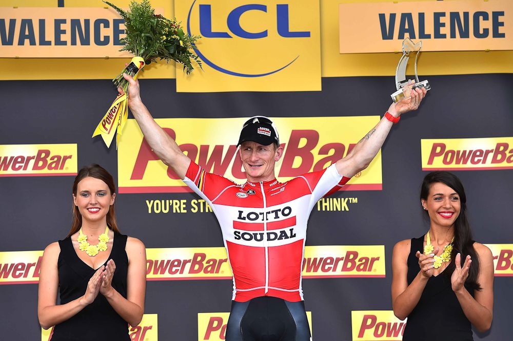 Andre Greipel celebrates on the stage 15 podium.