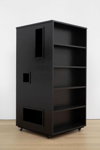 black room divider with shelves by Ryan Preciado