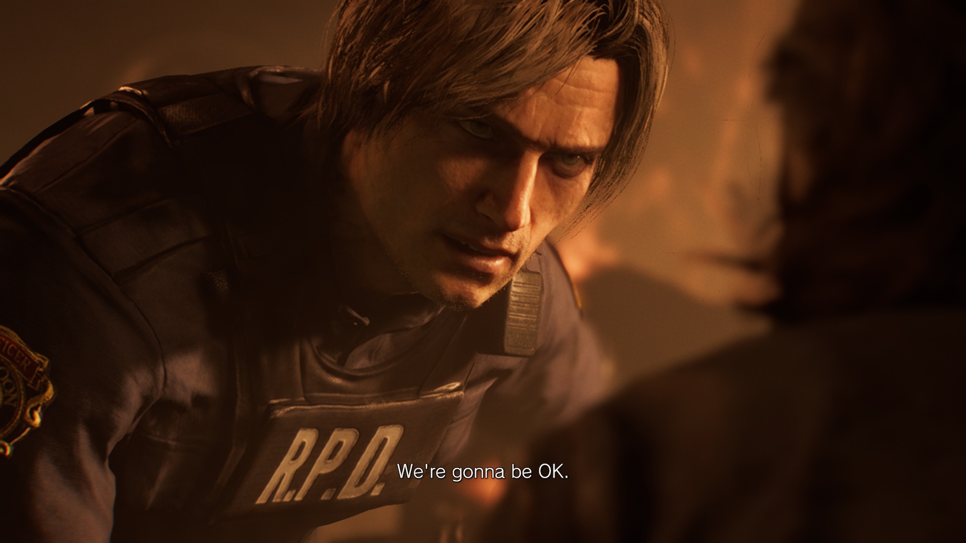 Leon Kennedy wears RPD tactical gear and leans down in Resident Evil Requiem to offer reassurance to a person on the ground, saying &amp;quot;We're gonna be OK&amp;quot;