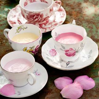 floral cups and saucers on metal table