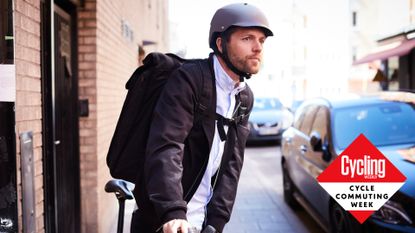 Image shows a person cycle commuting to work