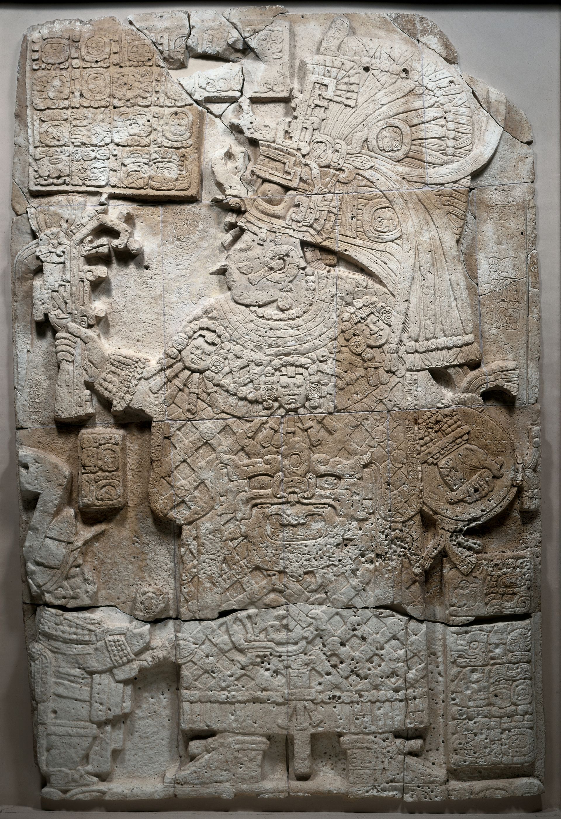 a carved limestone portrait of an ancient Maya queen