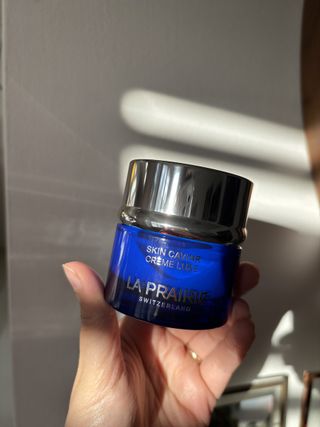 Mica Ricketts holding pot of La Prairie Skin Caviar Luxe Cream