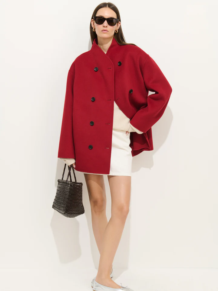 A model wearing a short red double-faced wool coat.