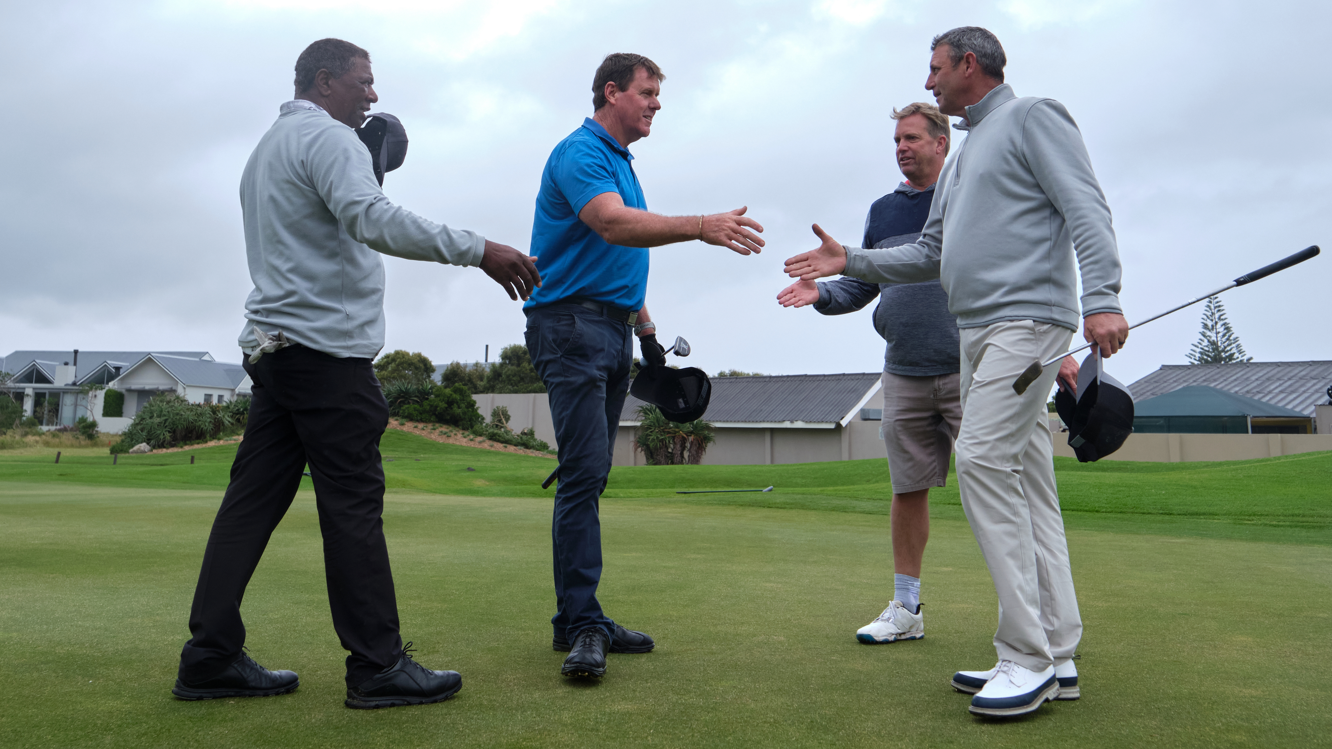 Golfers shaking hands at the end of a game
