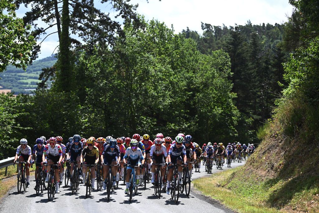 MAURIAC FRANCE JULY 24 A general view of the peloton passing through a forest landscape during the 2nd Tour de France Femmes 2023 Stage 2 a 1517km stage from ClermontFerrand to Mauriac UCIWWT on July 24 2023 in Mauriac France Photo by Tim de WaeleGetty Images