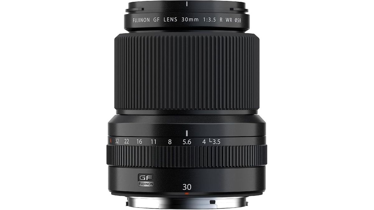 A Fujifilm GF 30mm f/3.5 R WR lens standing upright
