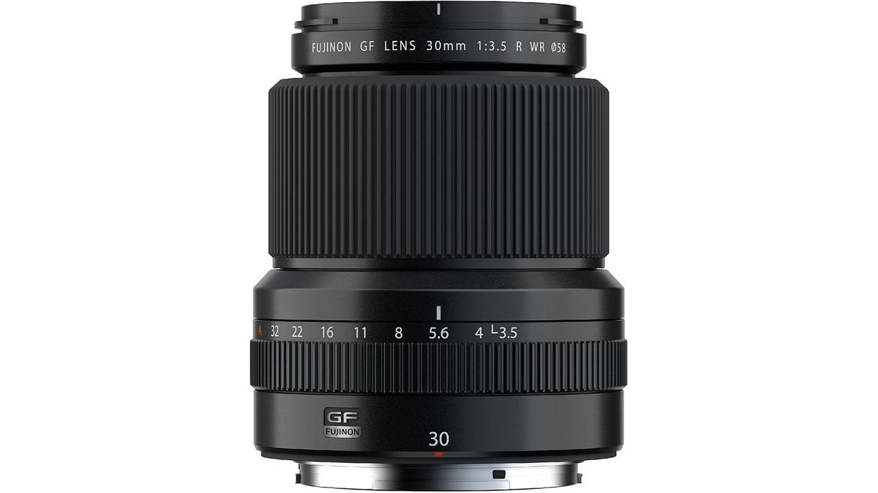 A Fujifilm GF 30mm f/3.5 R WR lens standing upright