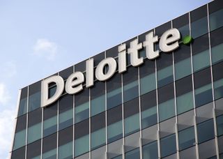 Deloitte sign on the side of an office building
