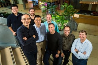 Microsoft researchers from the Speech & Dialog research group include, from back left, Wayne Xiong, Geoffrey Zweig, Xuedong Huang, Dong Yu, Frank Seide, Mike Seltzer, Jasha Droppo and Andreas Stolcke. (Photo by Dan DeLong)