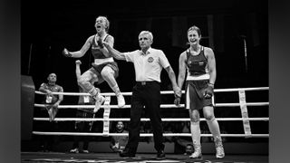 Photograph titled 'Victory and Defeat', taken by Vladimir Tadic from Bosnia and Herzegovina and the winner of the Sports category of the 14th season of the HIPA (Hamdan bin Mohammed bin Rashid Al Maktoum International Photography Award) photography competition. Image description: In a boxing ring, a referee grips the wrists of two teenage girls, one of them about to be declared the winner. As the referee raises the victor's arm, she bursts into a moment of pure euphoria, her face lit with joy and triumph, realising that months of training, sacrifice and termination have led to this achievement. Beside her, the defeated opponent is overwhelmed by disappointment. Her body language speaks volumes, a mix of exhaustion, heartbreak and the sting of coming so close. Yet, in that contrast between joy and sorrow, lies the essence of competitive sport.
