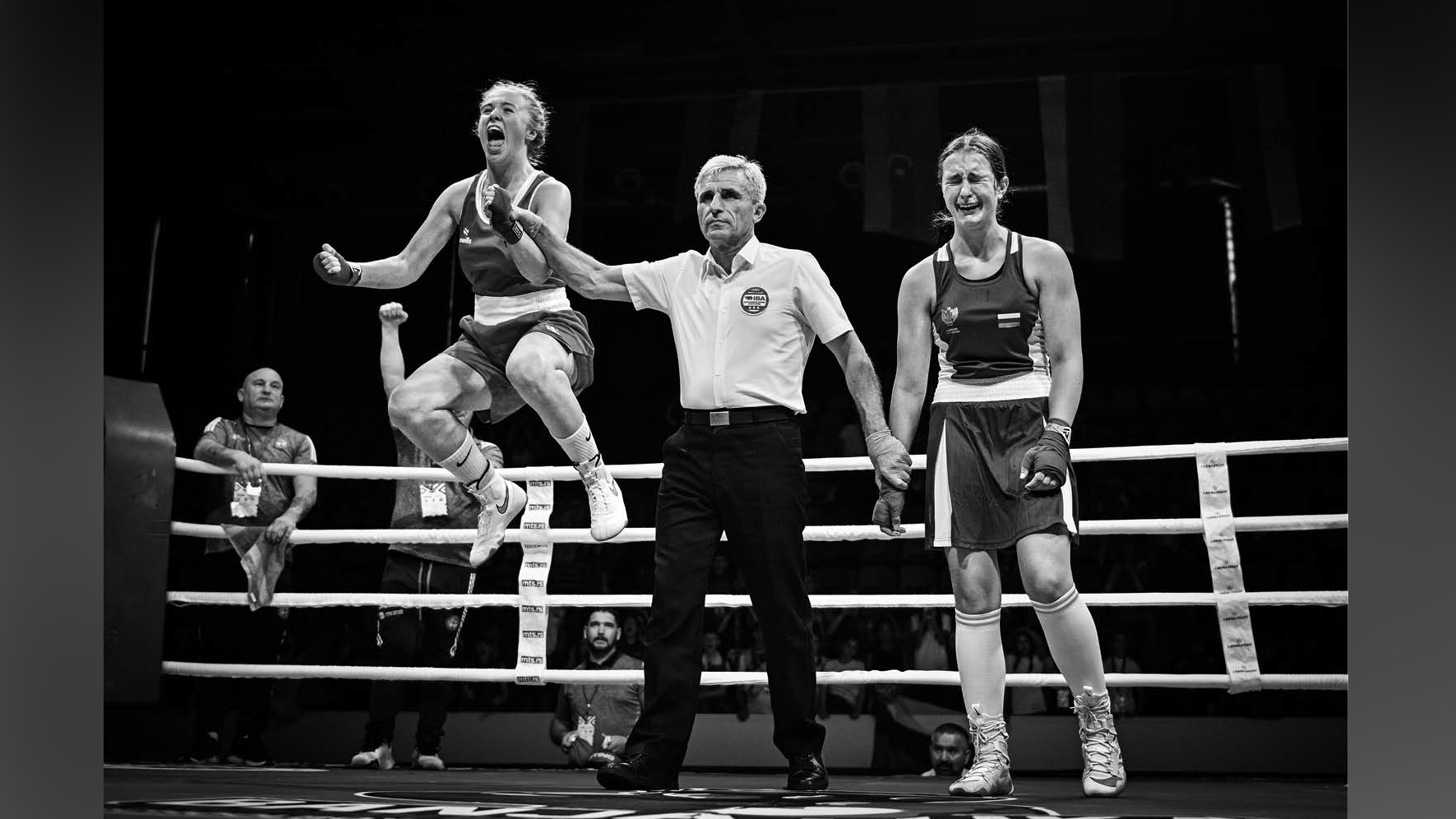 Photograph titled 'Victory and Defeat', taken by Vladimir Tadic from Bosnia and Herzegovina and the winner of the Sports category of the 14th season of the HIPA (Hamdan bin Mohammed bin Rashid Al Maktoum International Photography Award) photography competition. Image description: In a boxing ring, a referee grips the wrists of two teenage girls, one of them about to be declared the winner. As the referee raises the victor's arm, she bursts into a moment of pure euphoria, her face lit with joy and triumph, realising that months of training, sacrifice and termination have led to this achievement. Beside her, the defeated opponent is overwhelmed by disappointment. Her body language speaks volumes, a mix of exhaustion, heartbreak and the sting of coming so close. Yet, in that contrast between joy and sorrow, lies the essence of competitive sport.