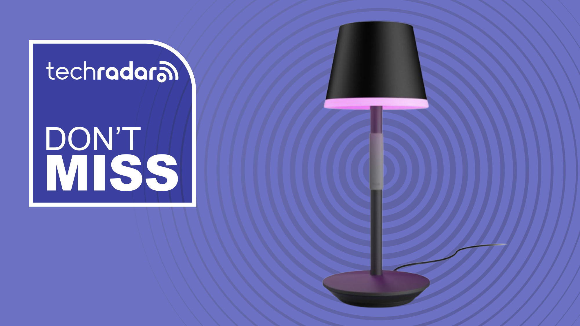 Philips Hue lamp on purple background with white text reading &#039;TechRadar don&#039;t miss&#039;