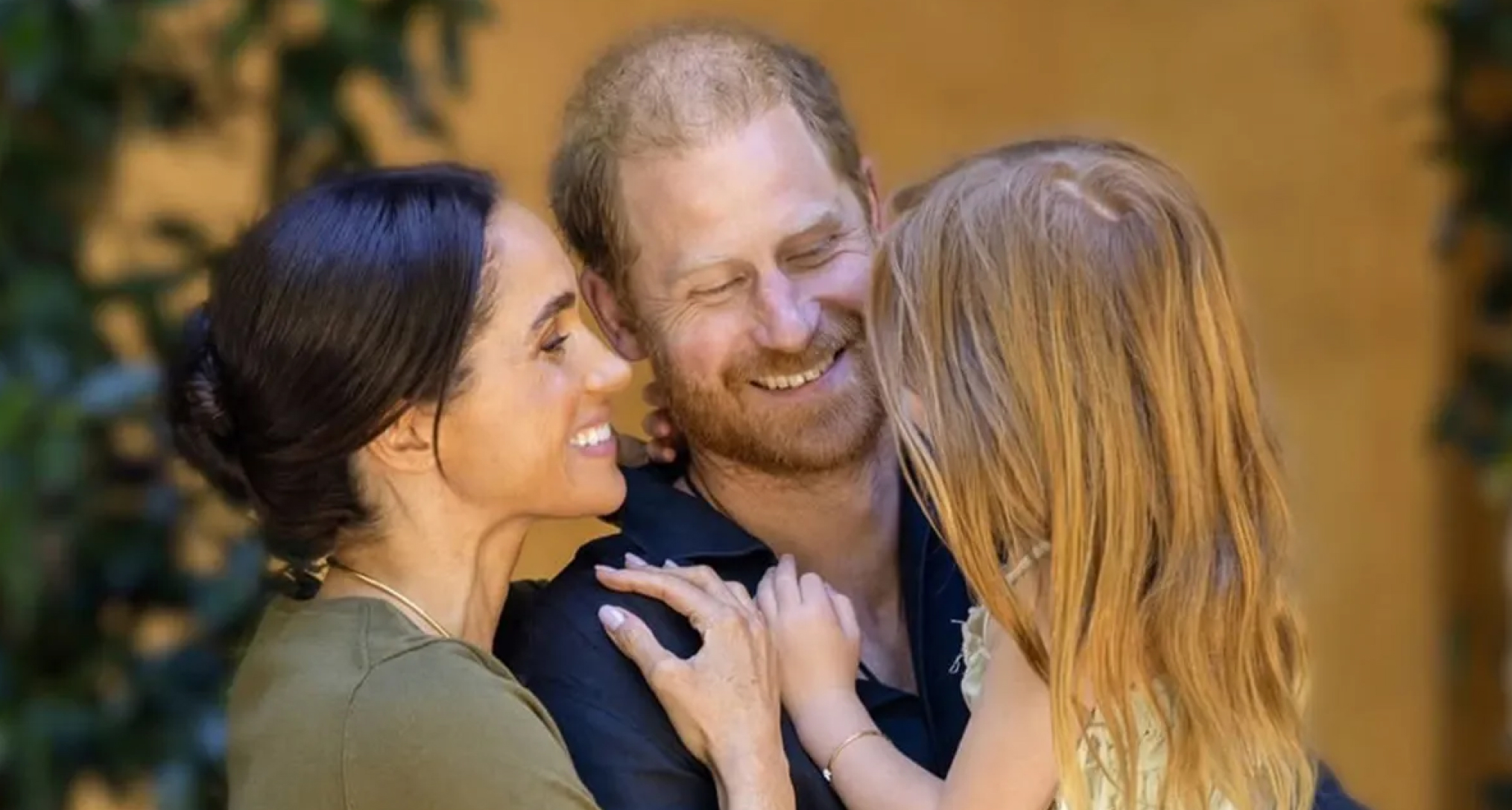 Prince Harry and Meghan Markle holding Princess Lilibet
