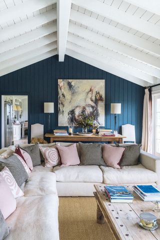 Blue country living room with a beige corner sofa