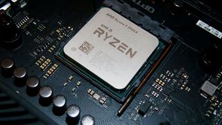An AMD Ryzen 9 5950X CPU within a motherboard AM4 socket