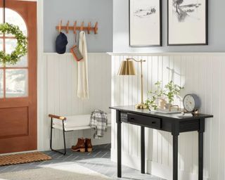 Front entryway with table and wall hooks