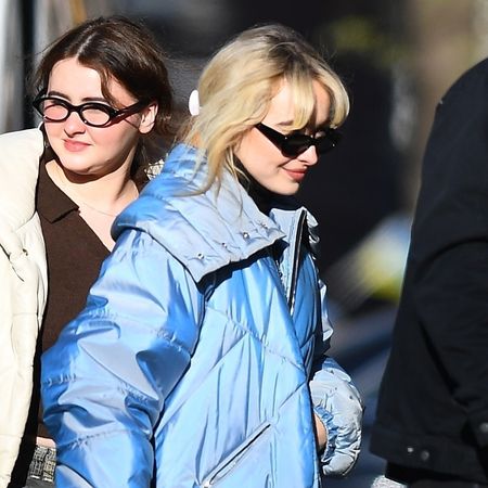 Sabrina Carpenter wearing a blue puffer in NYC