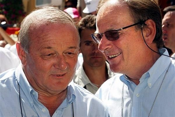 ASO President Patrice Clerc talks with outgoing Tour de France director and ASO Deputy General director Jean-Marie Leblanc (L)