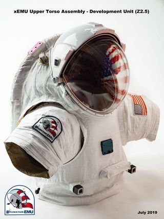 a torso of a spacesuit on a table