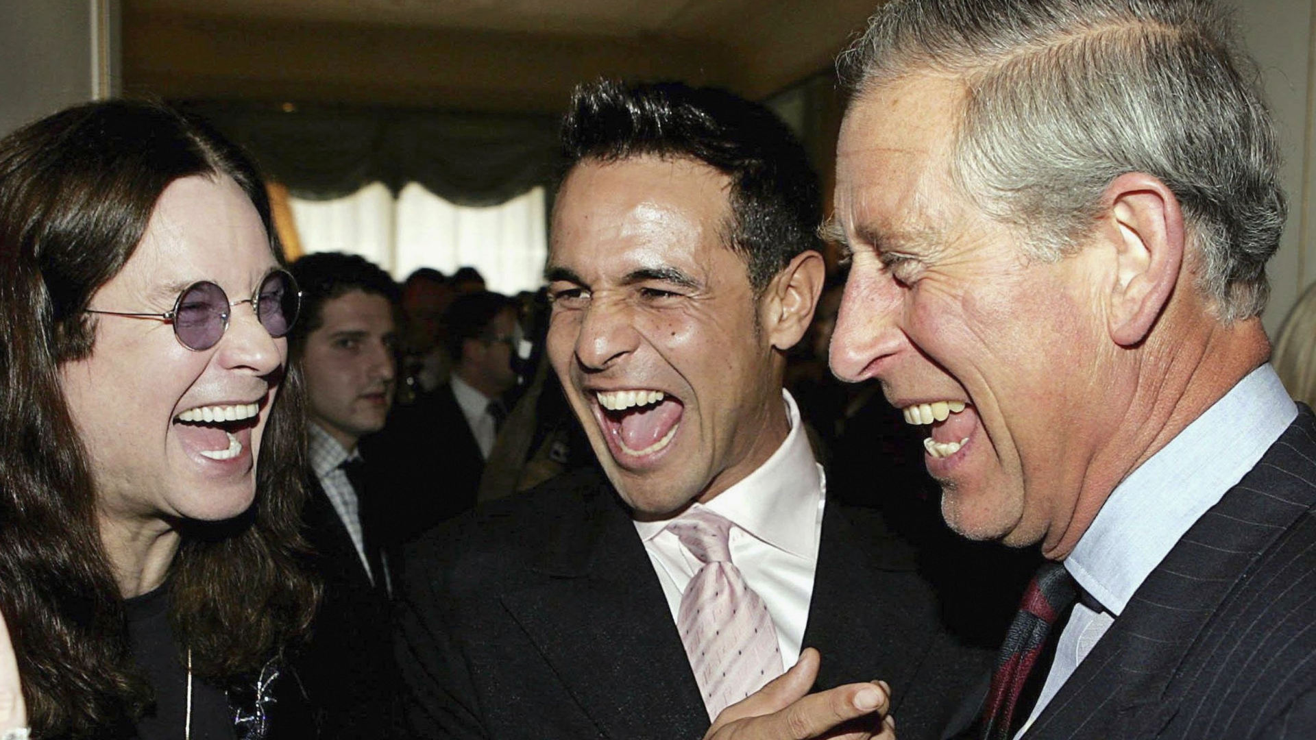 King Charles laughing with Ozzy Osbourne