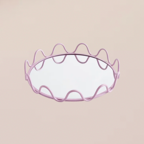 A mirror tray with a wavy lilac trim