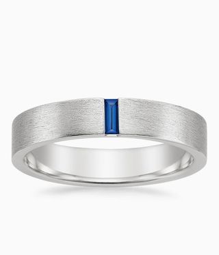 Silver band with blue sapphire set into it