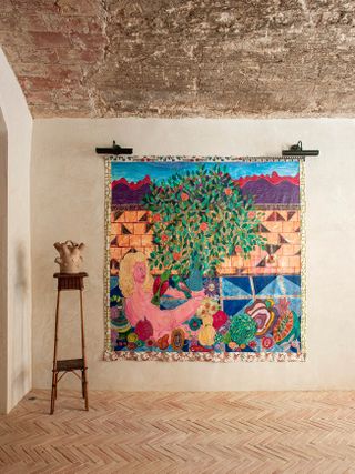 A vibrant artwork on whitewashed walls