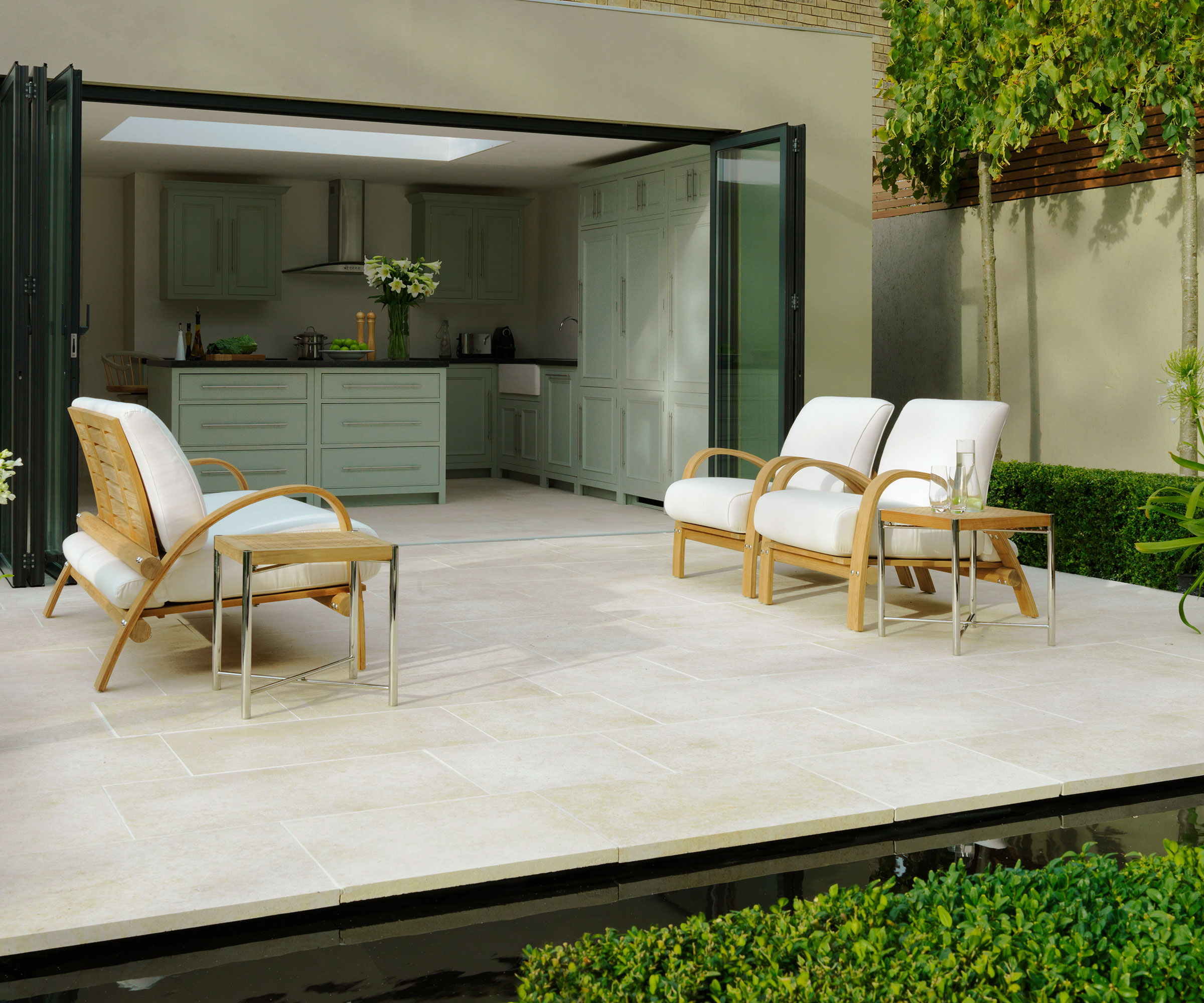 black aluminium bifold doors leading to modern patio