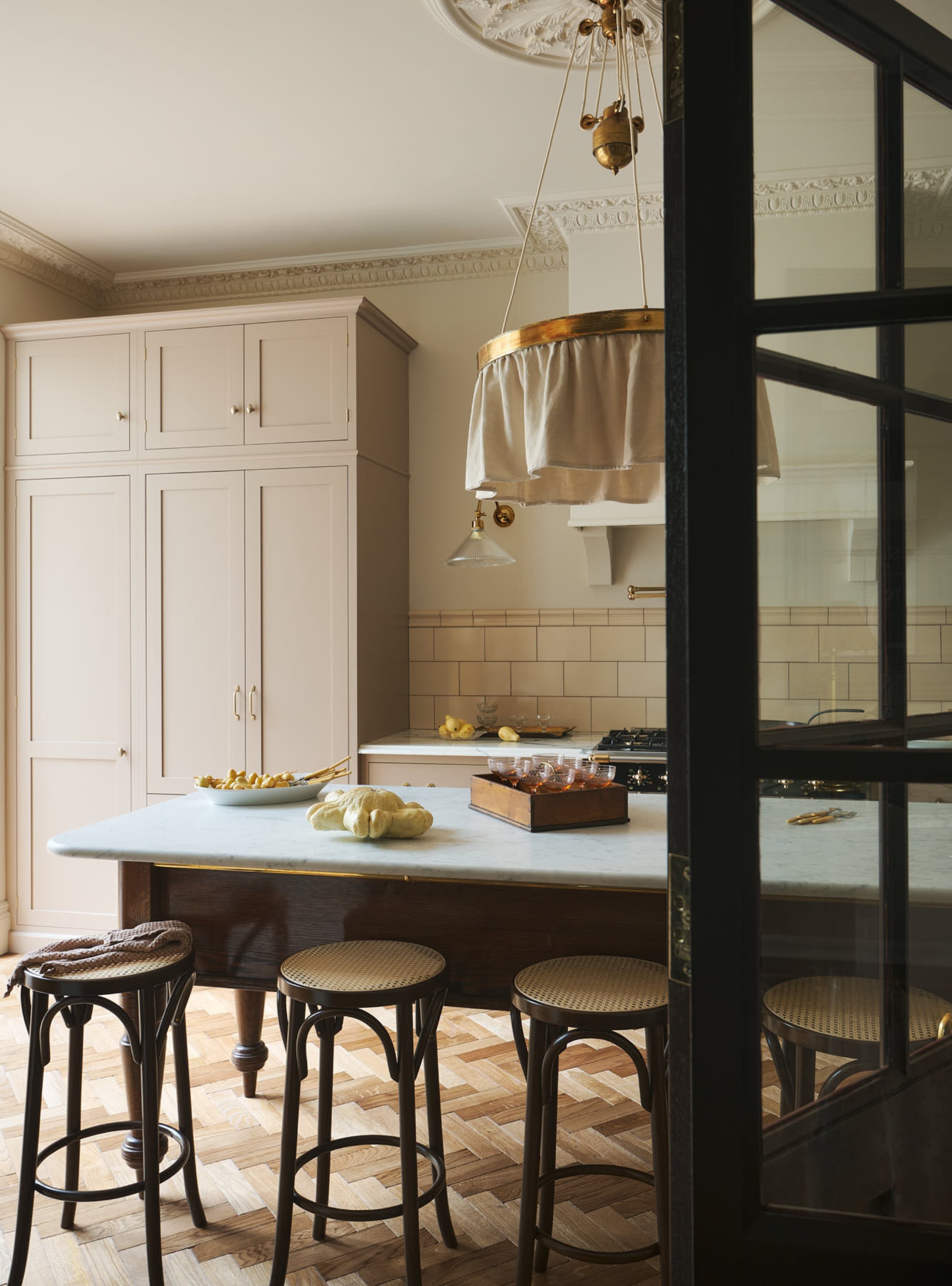 putty beige kitchen by deVOL with parquet flooring and subway tiles