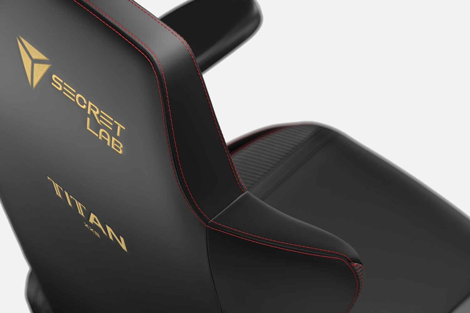 closeup of black gaming chair showing back and logo
