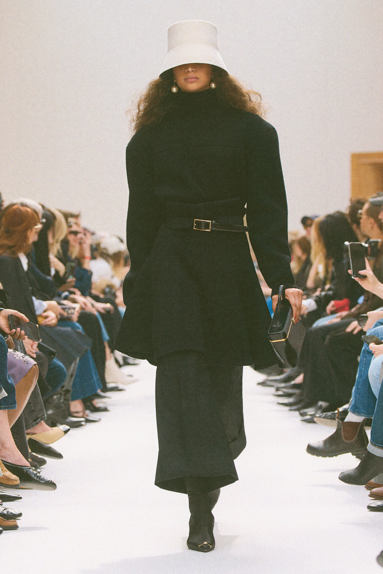 a model walks the celine f/w 26 runway.