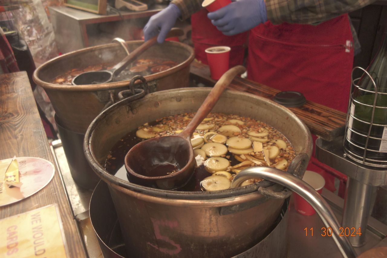 Mulled wine closeup in the city of Bath, UK, with retro photo picture effect