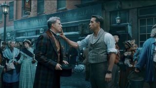 Ryan Reynolds shushes Will Ferrell on an old timey Dickensian street in Spirited.