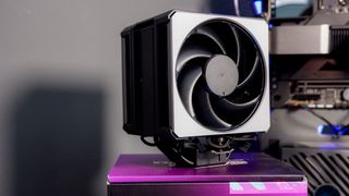 A Cooler Master Hyper 612 Apex on a desk and installed on a gaming PC.