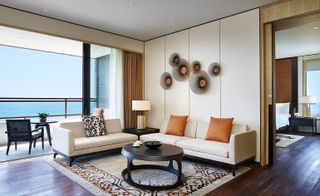 Rugs and even the backs of low-slung chairs are used in living room