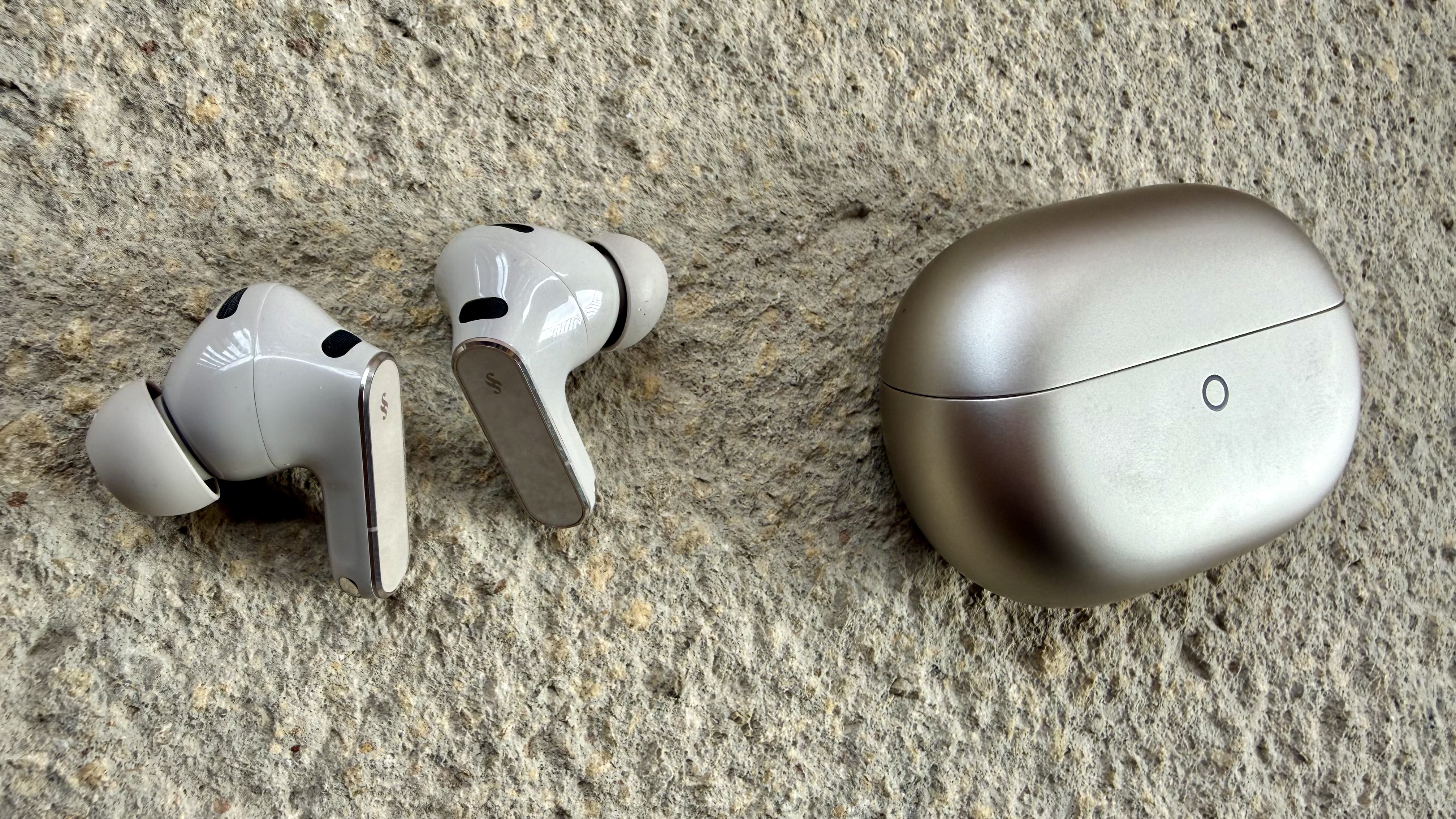 The Huawei FreeBuds Pro 5 earbuds next to their charging case