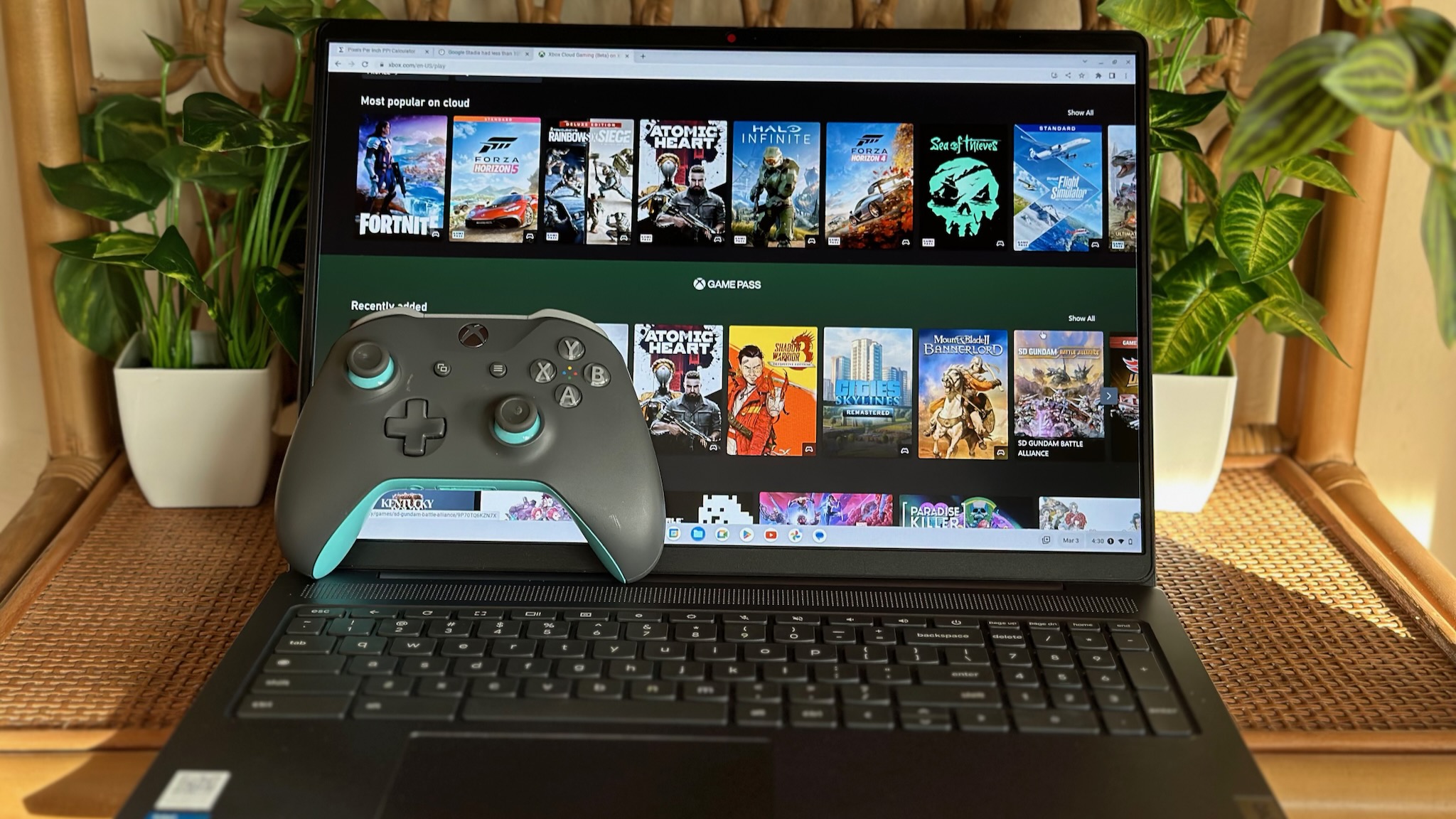 Lenovo 5i Chromebook (16-inch) showing Xbox Cloud Gaming with an Xbox controller sitting in front.