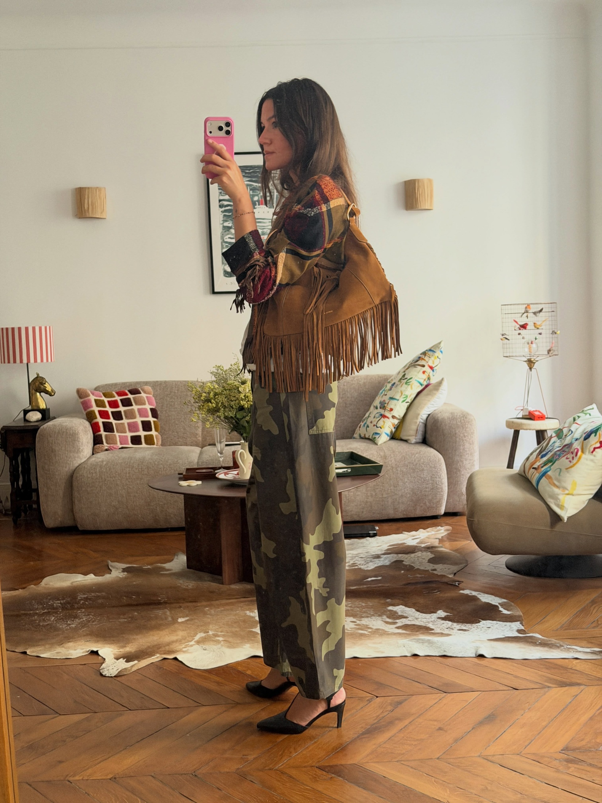 A woman wearing a camo-pant outfit in 2026.