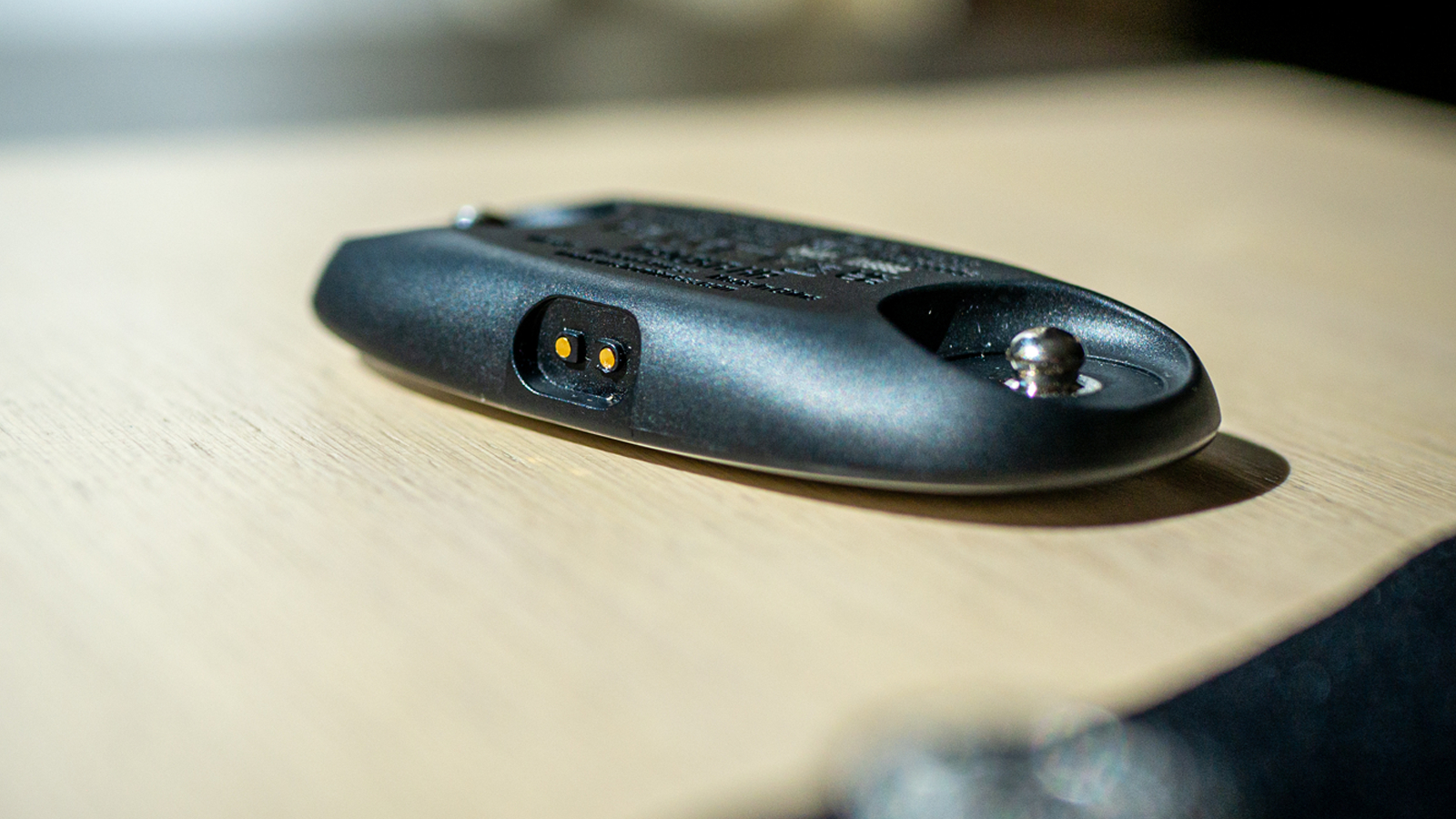 Wahoo Trackr on a table showing the charging port