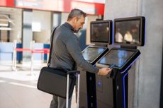 Traveler uses digital kiosk at airport