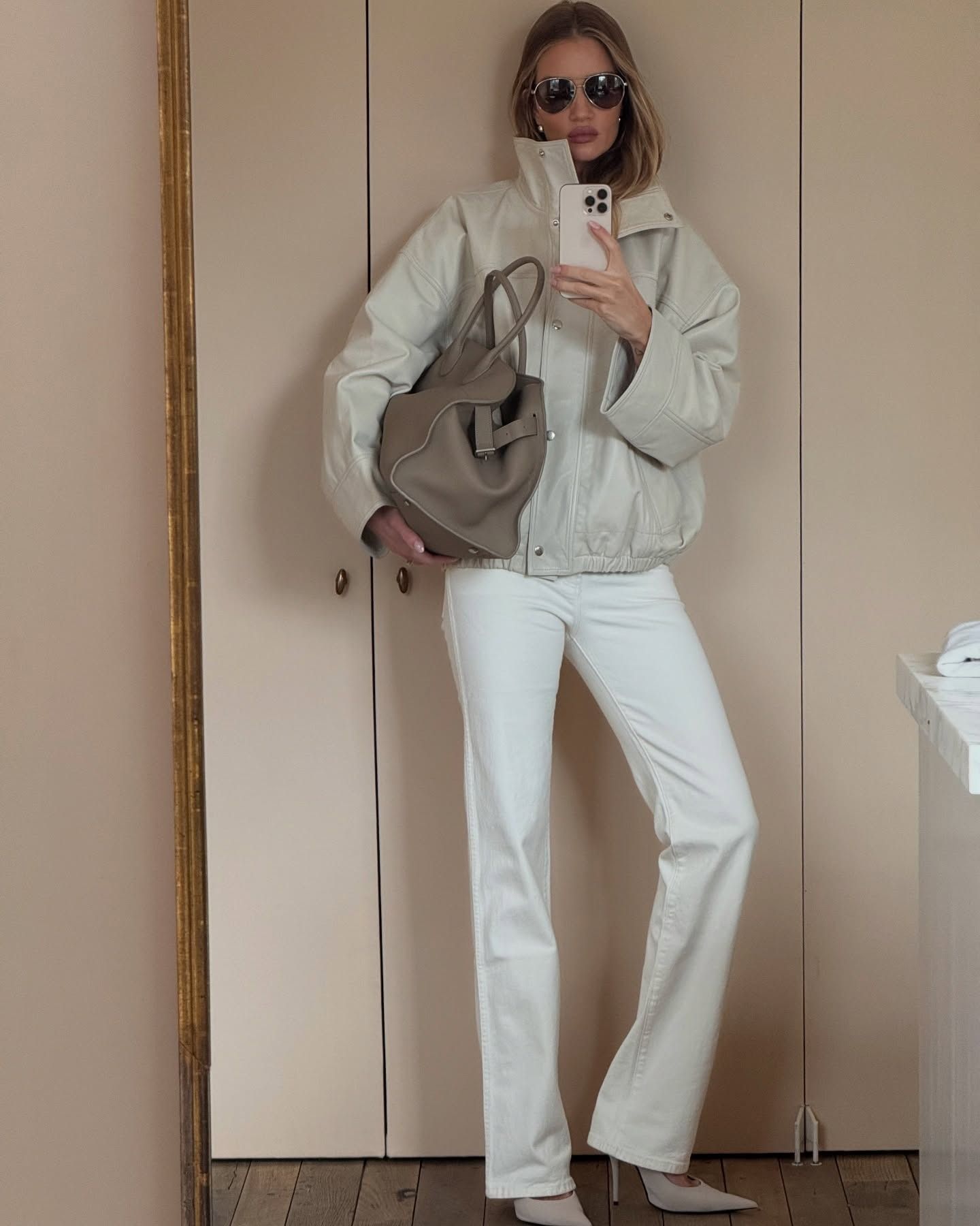 Fashion person Rosie Huntington-Whiteley wear the funnel neck jacket trend