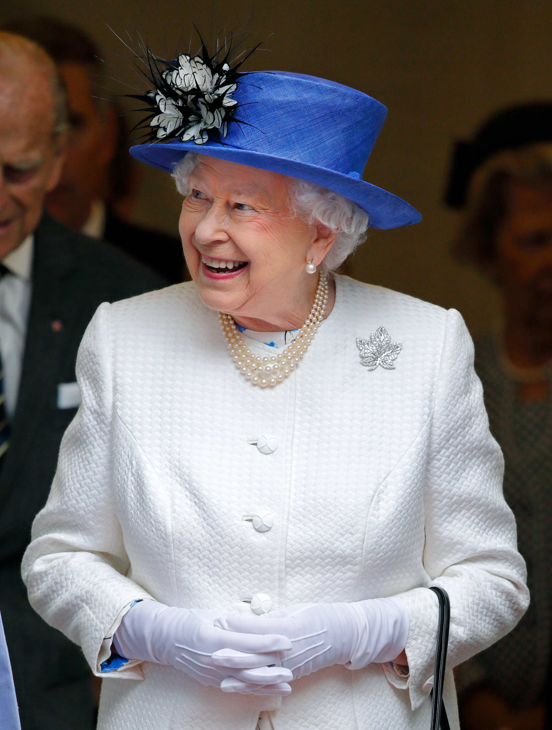 Queen Elizabeth II wearing a brooch shaped like a maple leaf
