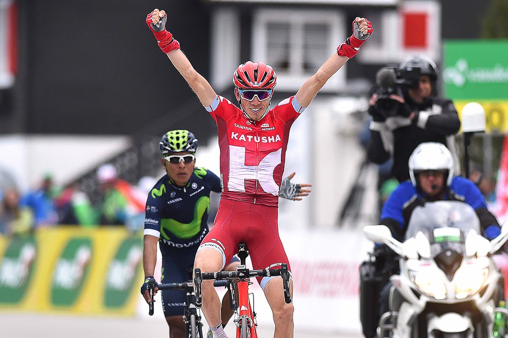 Zakarin celebrates as Quintana sits up at the end of stage 4 at the Tour de Romandie.