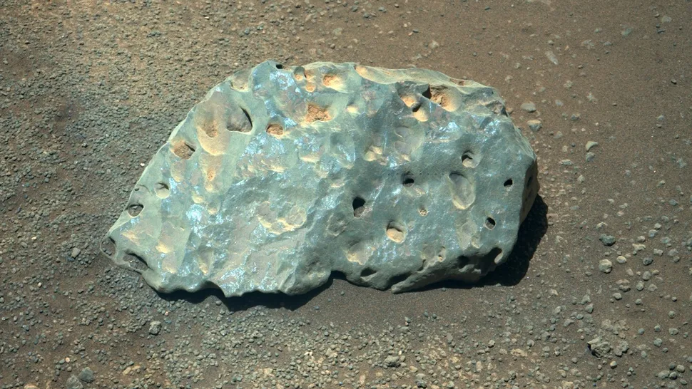 A weirdly green rock with "drill holes"