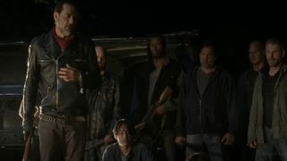 Negan standing over Glenn in The Walking Dead.