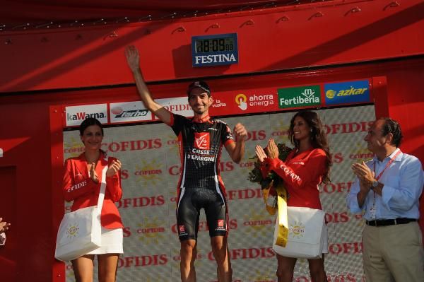 David Lopez (Caisse d'Epargne) salutes from the podium in Alcoy after his Vuelta stage victory.