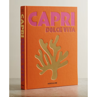 orange hardback book reading capri dolce vita in pink