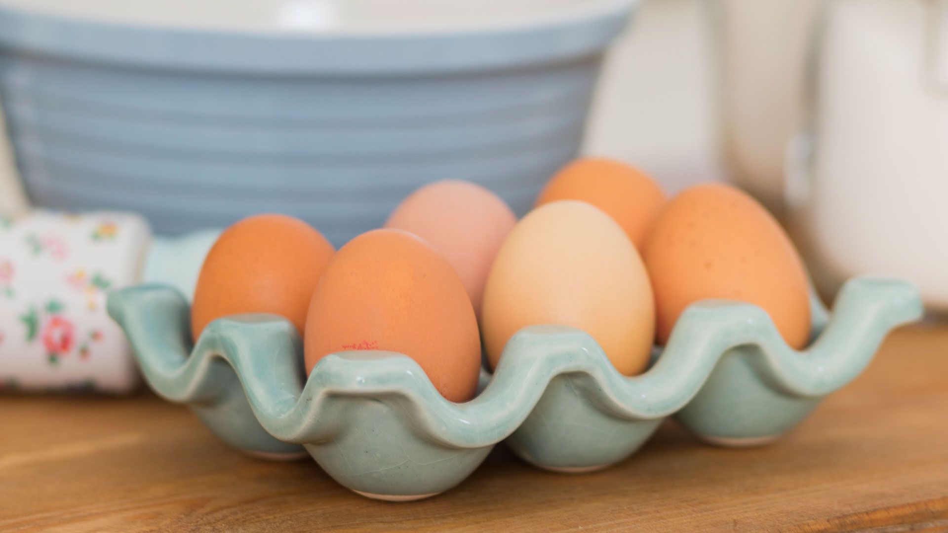 Eggs in a ceramic holder to show things you should never put in a microwave