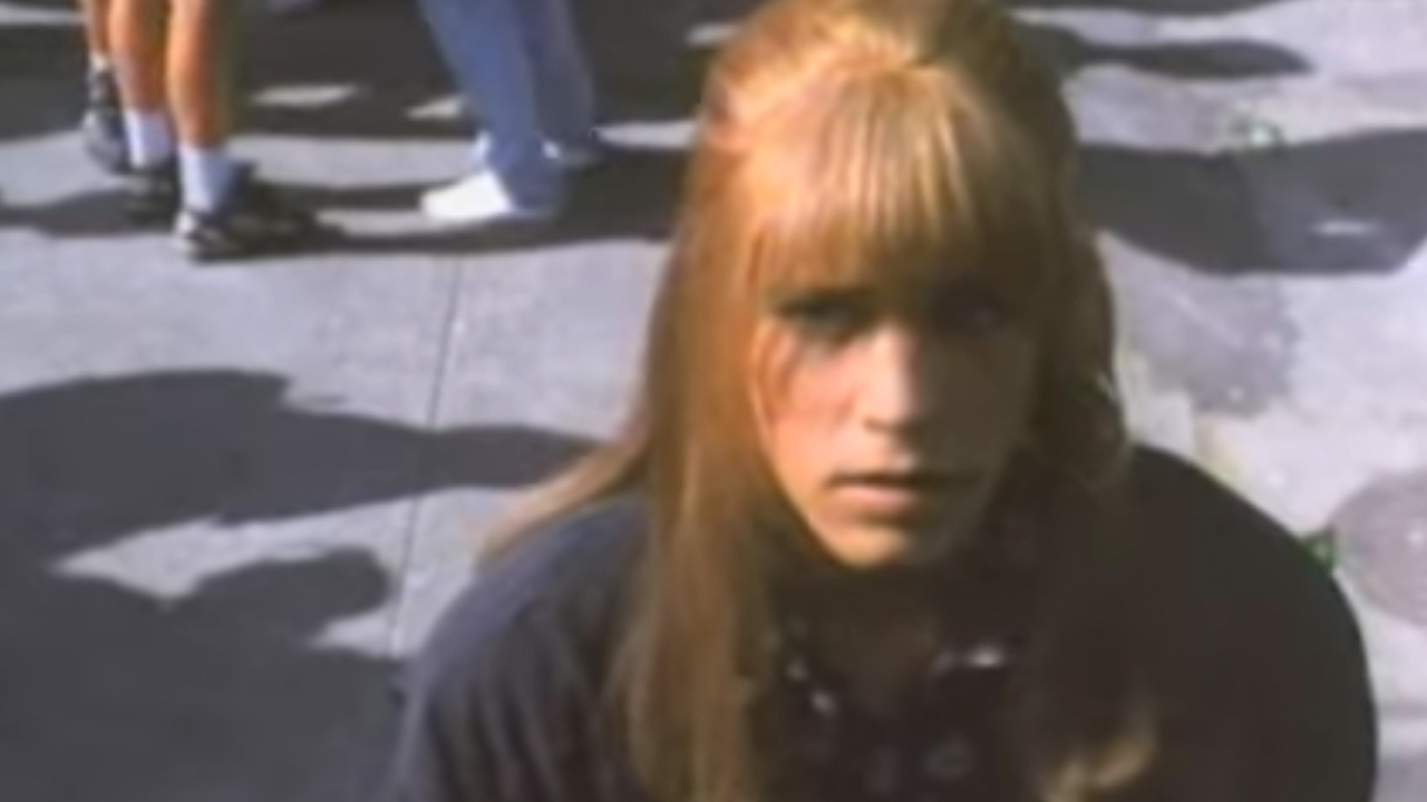 Corey Haim dressed like a girl in Anything for Love.